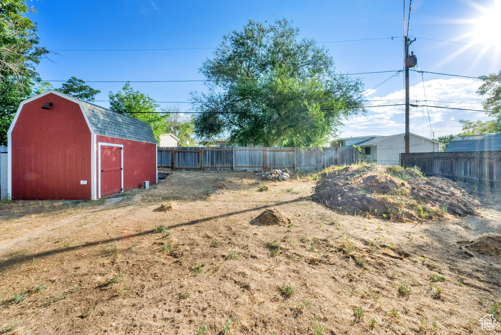 View of yard featuring a storage unit