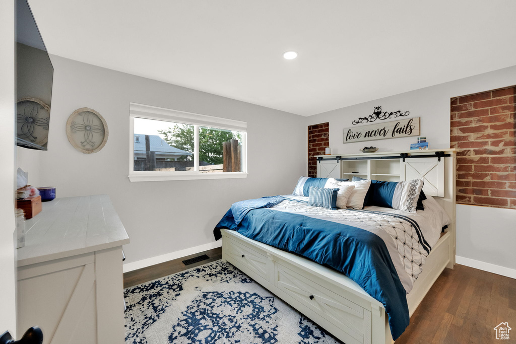 Bedroom featuring wood finished floors and recessed lighting