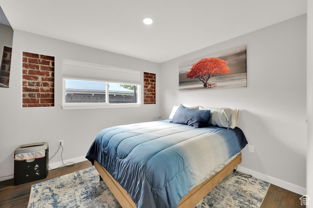 Bedroom featuring wood finished floors and recessed lighting