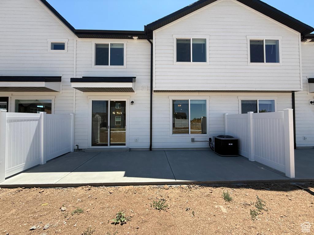 Back of house with a patio area