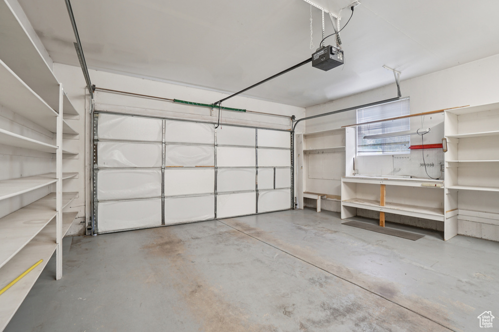 Garage featuring a garage door opener