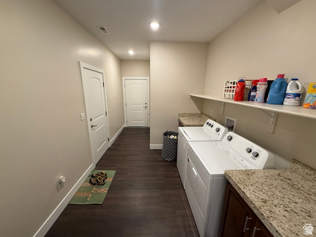 Washroom featuring separate washer and dryer, dark wood-style floors, and recessed lighting