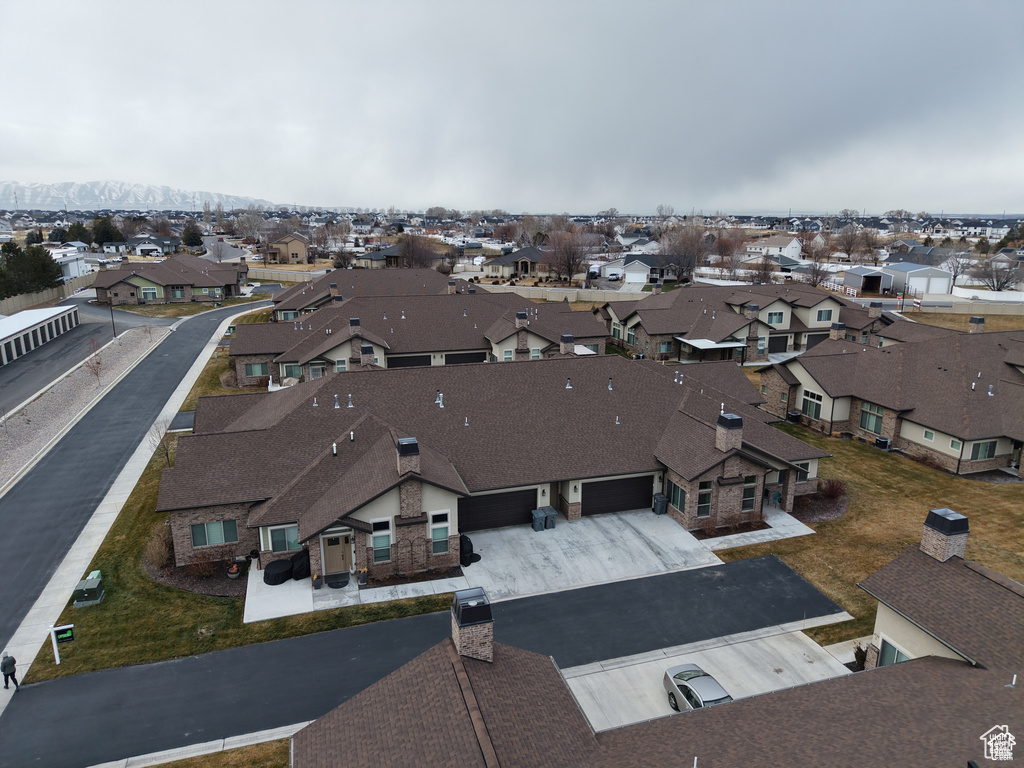 Aerial perspective of suburban area with a mountain backdrop