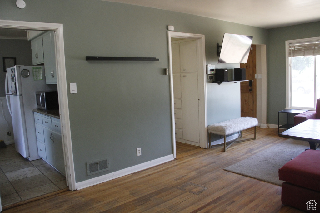 Living room with wood finished floors and baseboards