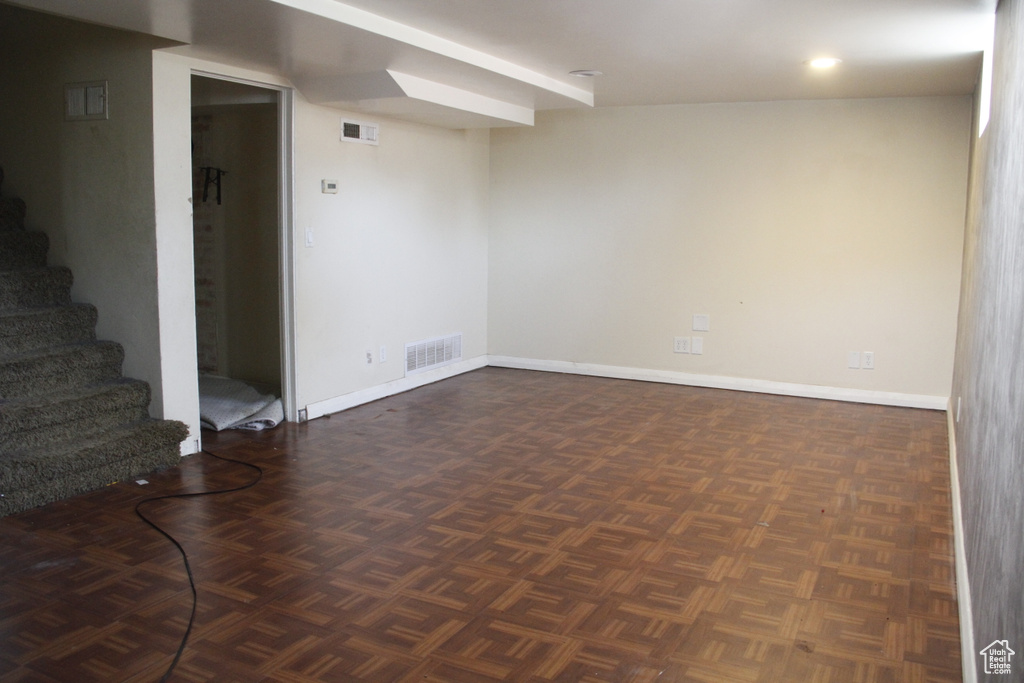 Below grade area with stairs and baseboards