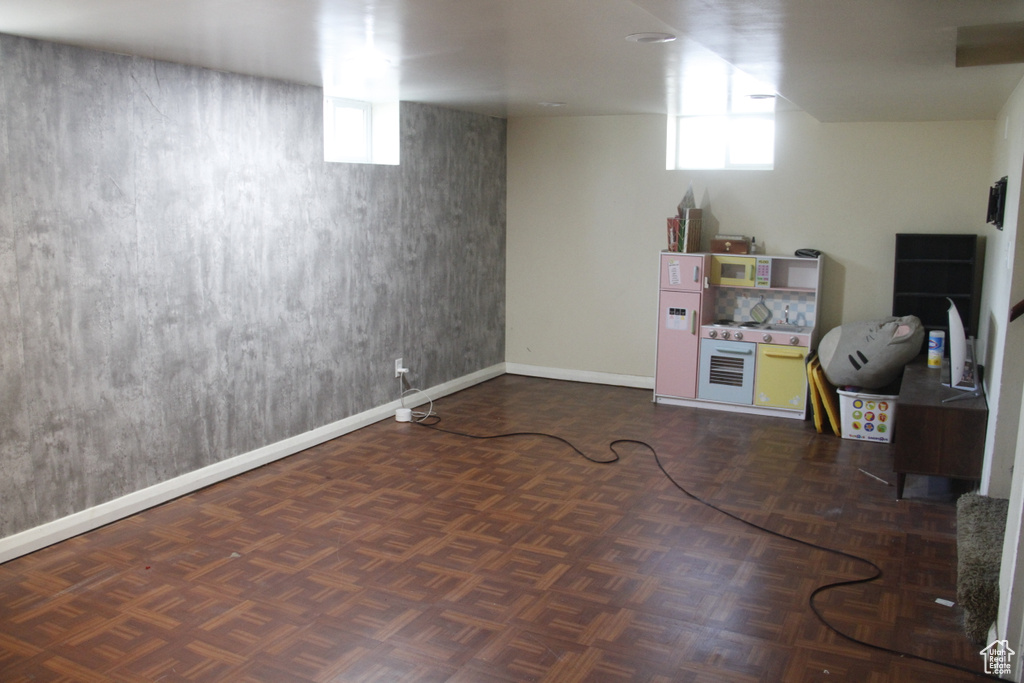 Below grade area featuring baseboards