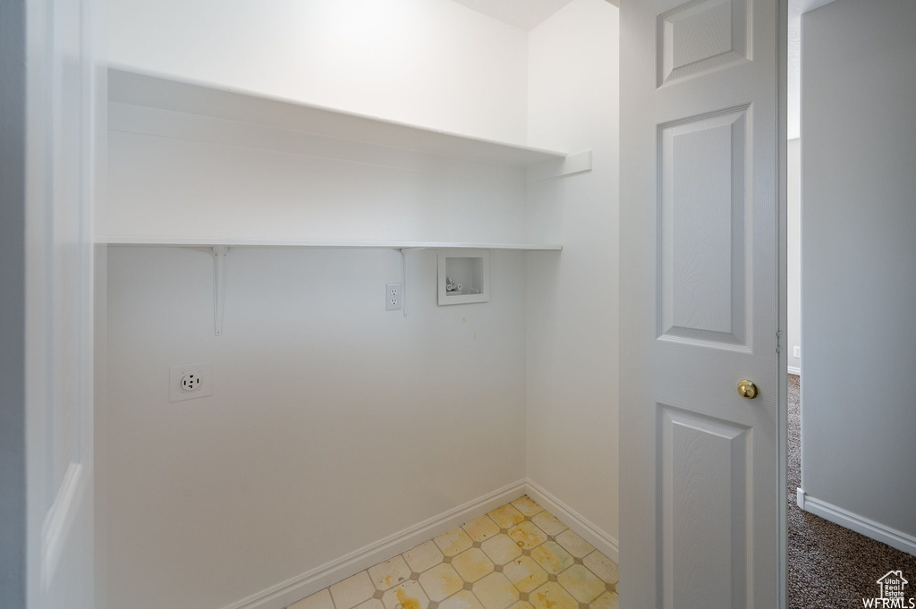 Laundry area with washer hookup and electric dryer hookup