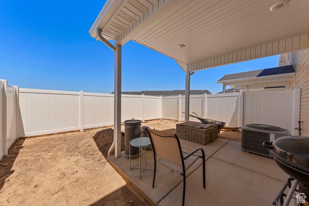 Fenced backyard with a patio