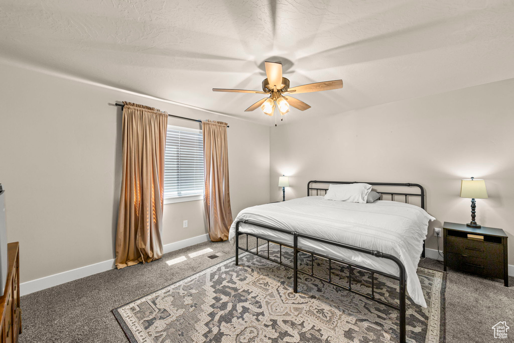 Bedroom with carpet and ceiling fan
