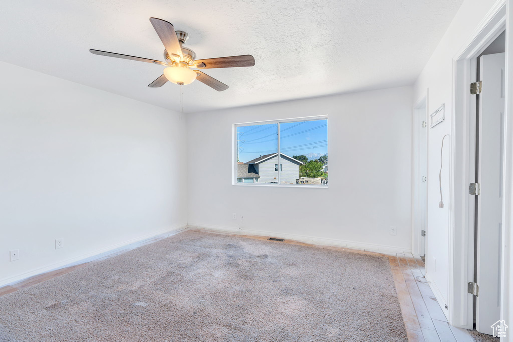 Unfurnished bedroom featuring ceiling fan and light wood-type flooring