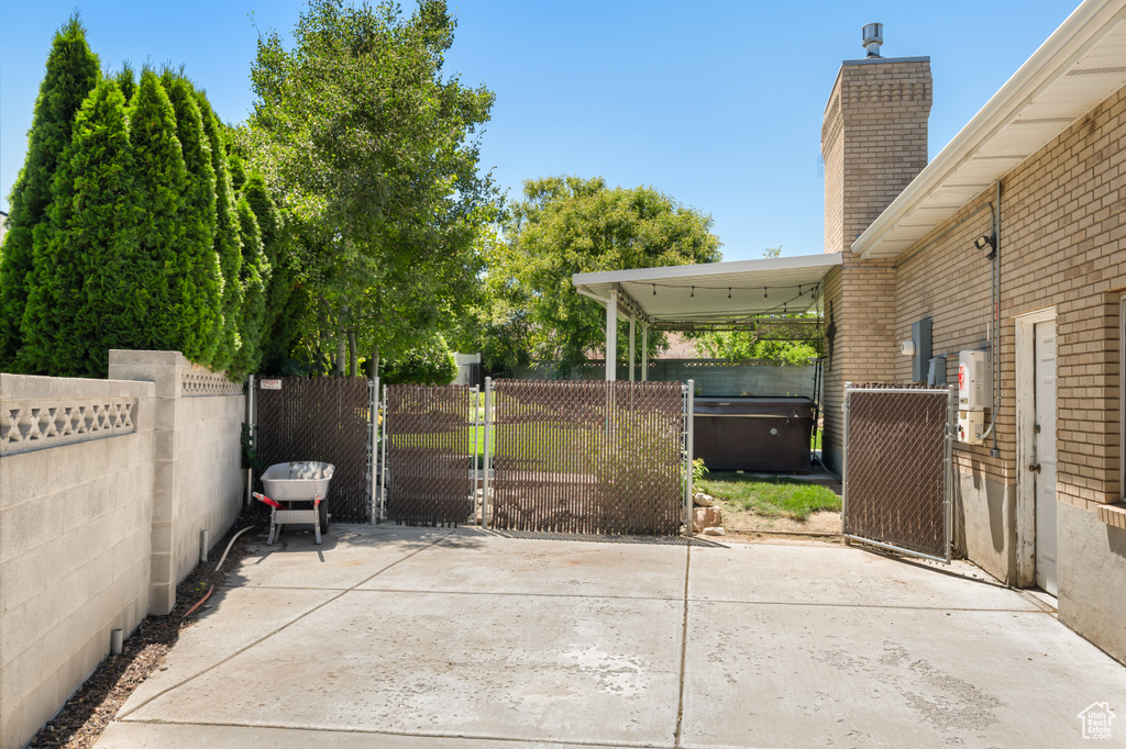 View of patio with a gate