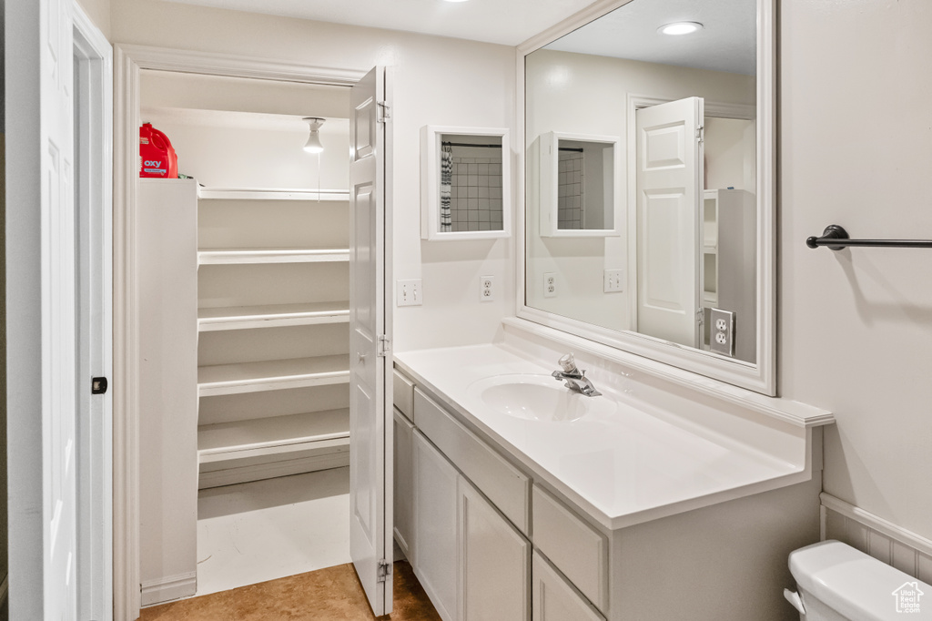 Bathroom featuring vanity and recessed lighting