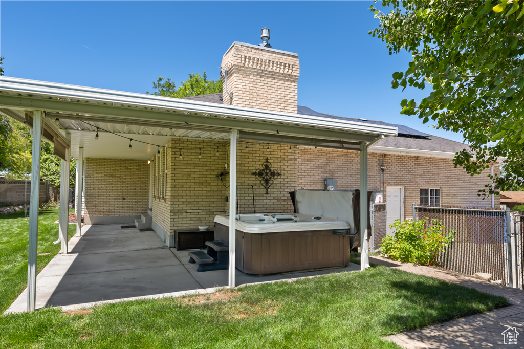 View of patio / terrace featuring a hot tub