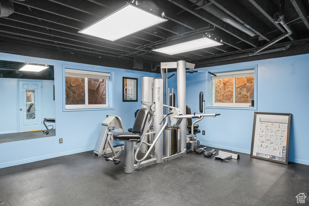 Workout area featuring baseboards