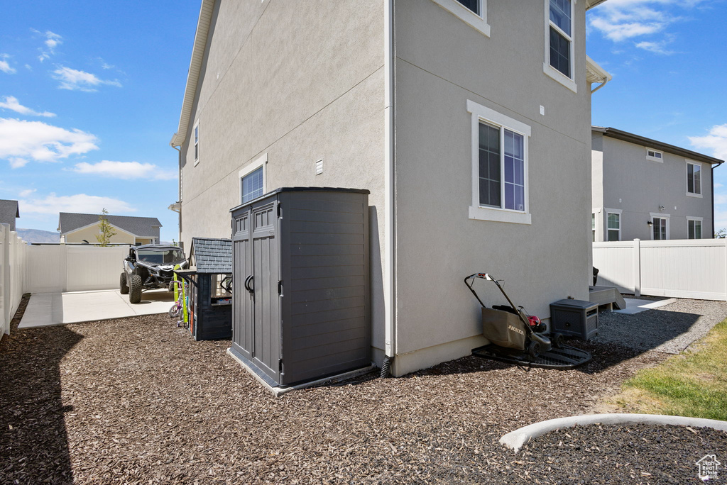 View of side of home with stucco siding