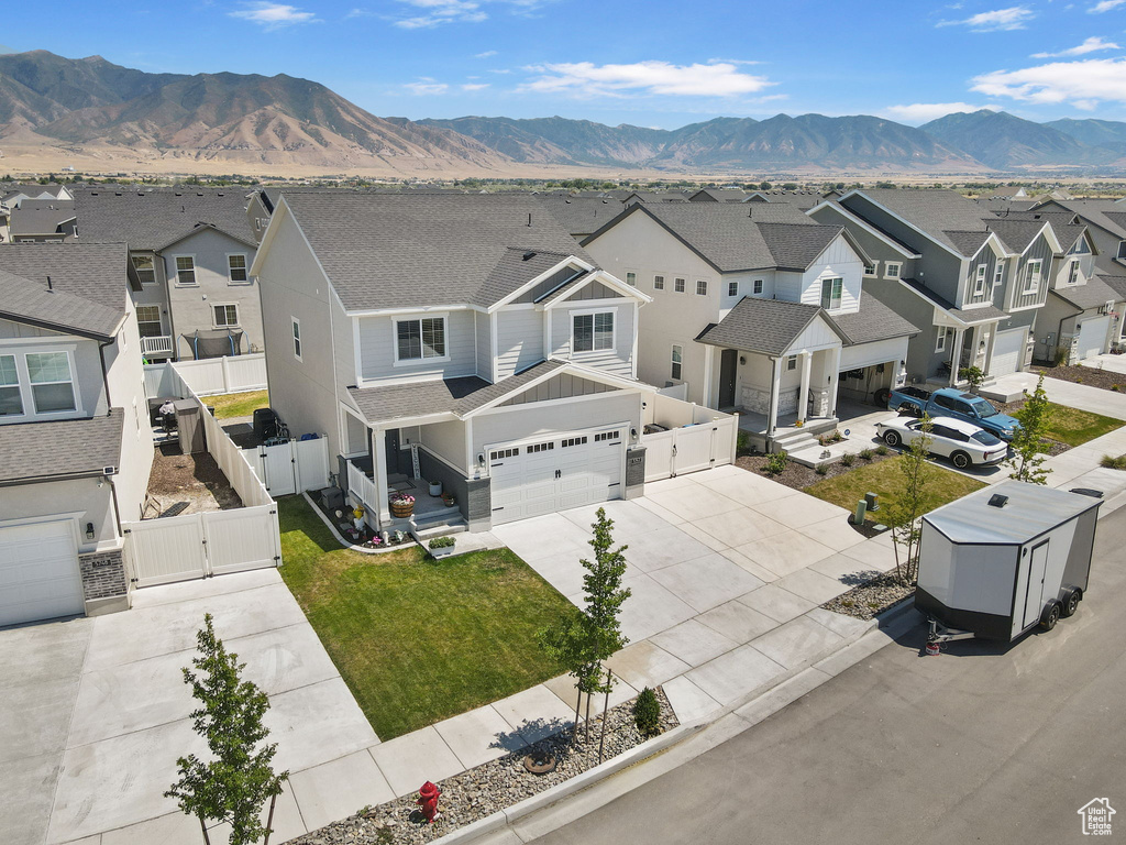 Aerial view of residential area with a mountainous background