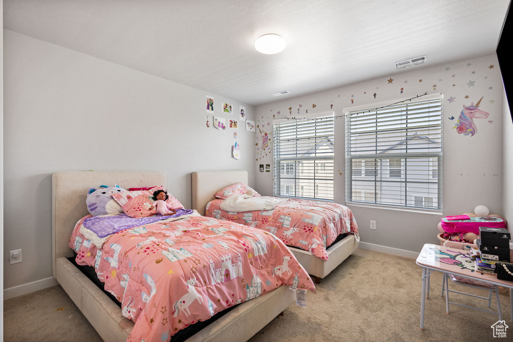 Carpeted bedroom with baseboards