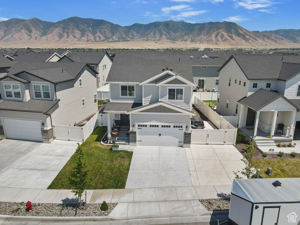 Aerial view of residential area featuring mountains