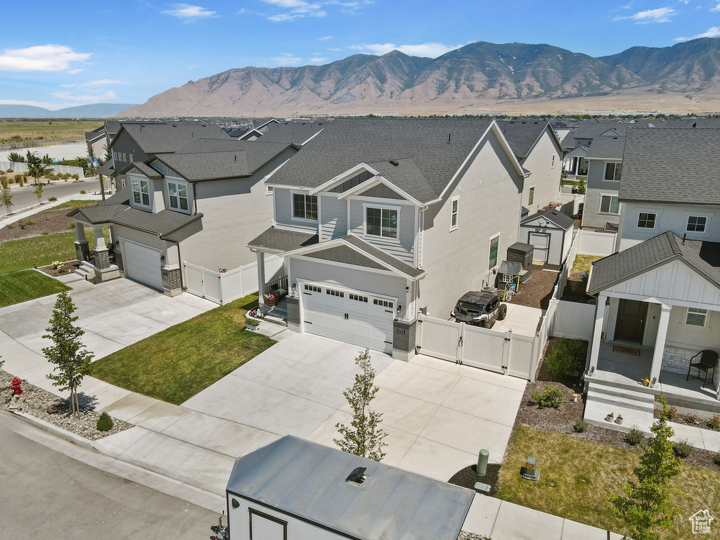Aerial view of residential area with a mountainous background