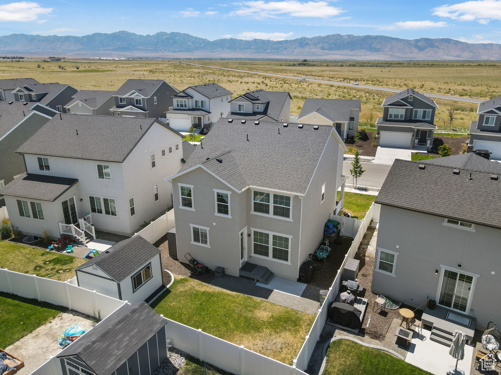 Aerial view of residential area with mountains