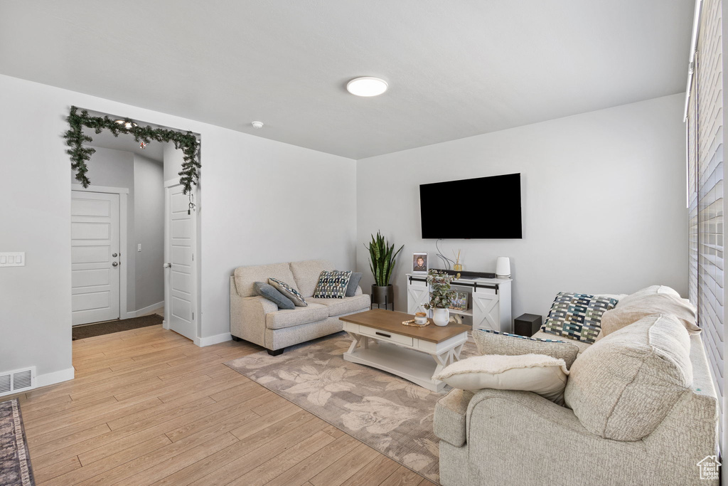 Living room featuring wood finished floors and baseboards