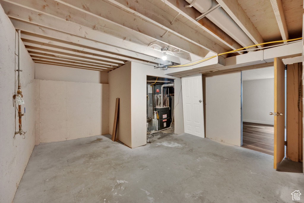 Unfinished basement with heating unit