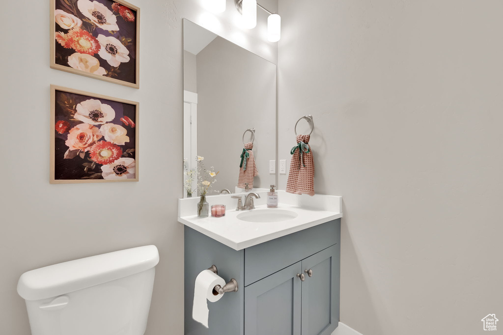 Half bath with vanity and toilet