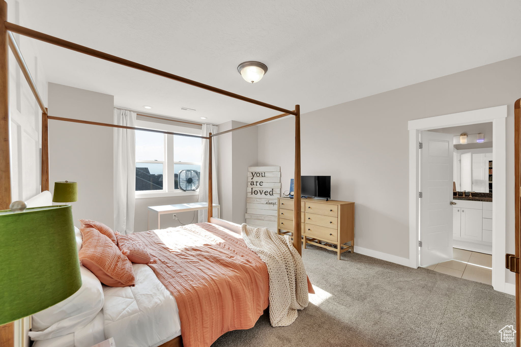 Carpeted bedroom with baseboards and recessed lighting