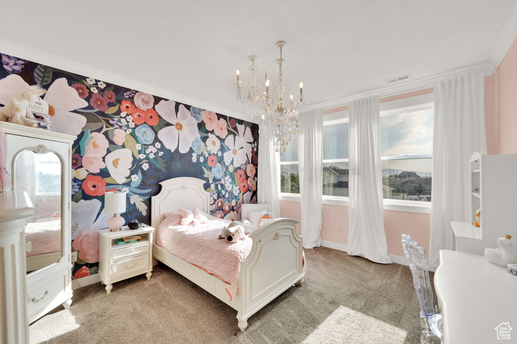 Bedroom with light colored carpet, crown molding, and a chandelier