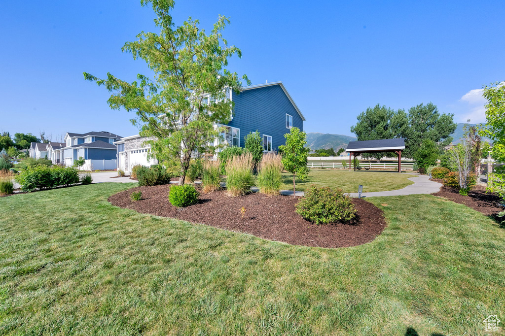 View of green lawn with a gazebo