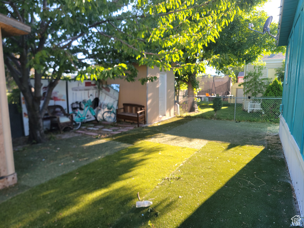 Fenced backyard with a shed