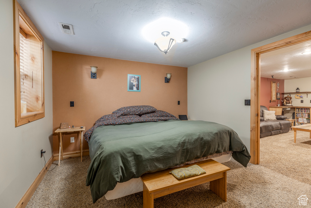 Bedroom with carpet flooring
