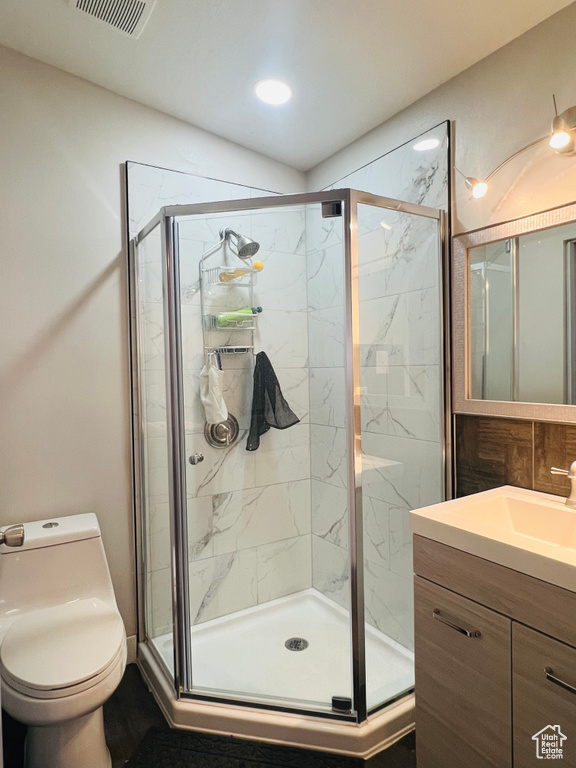Bathroom with vanity and a stall shower
