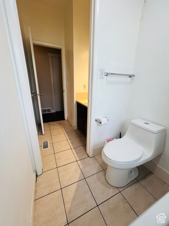 Bathroom featuring vanity and tile patterned flooring