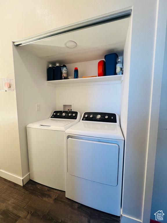 Laundry room with separate washer and dryer and dark wood finished floors