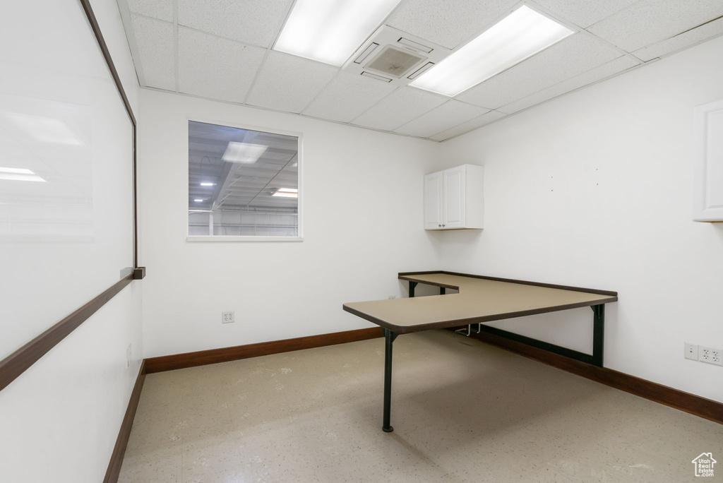 Unfurnished office with a drop ceiling
