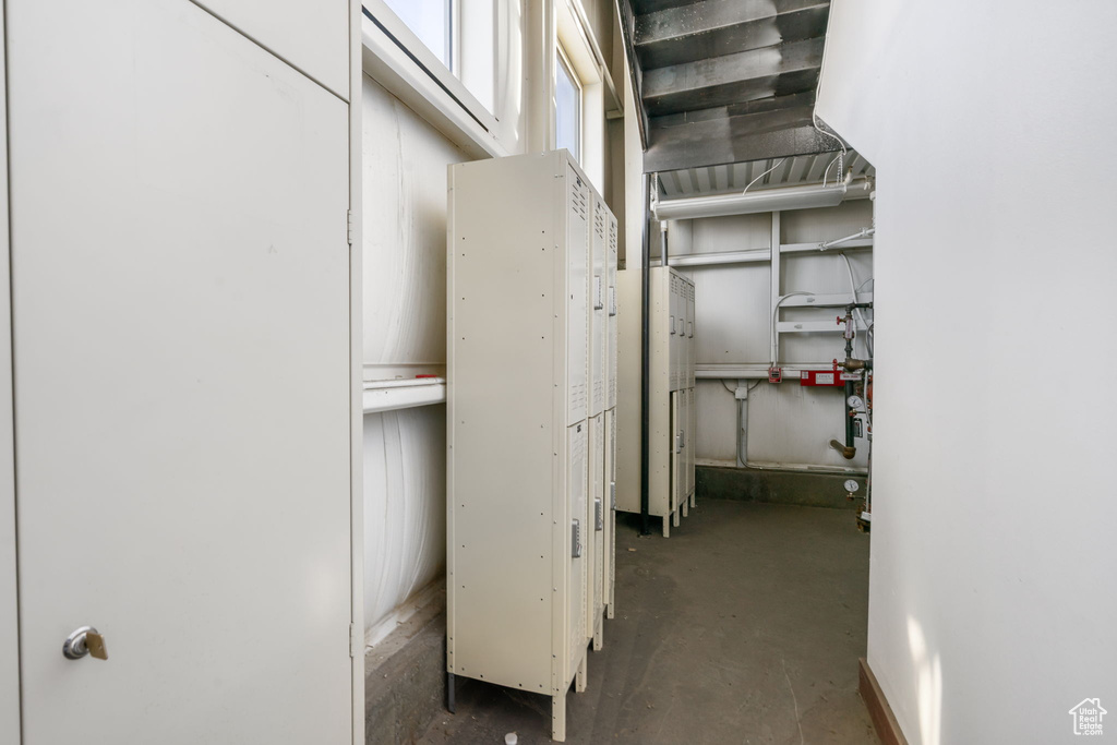 Hall with unfinished concrete flooring