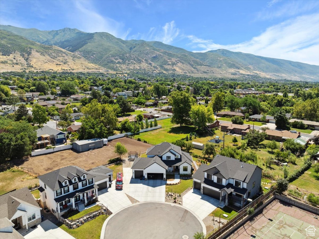 Aerial perspective of suburban area featuring a mountainous background