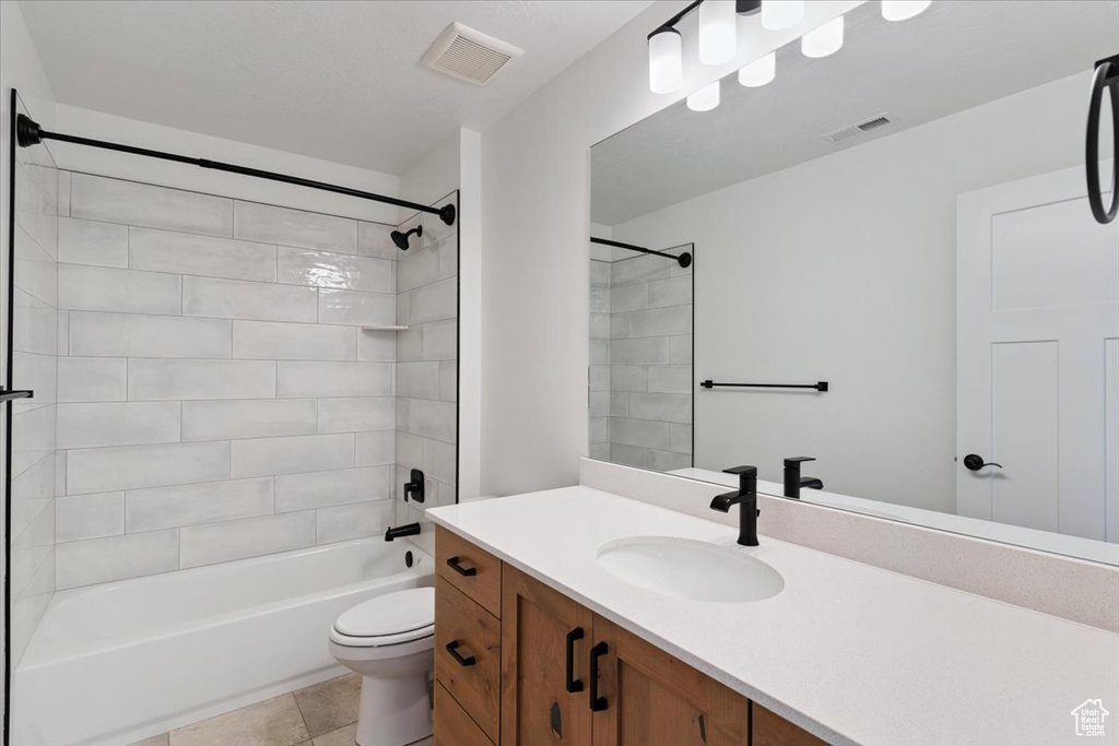 Full bath with vanity,  shower combination, and tile patterned flooring
