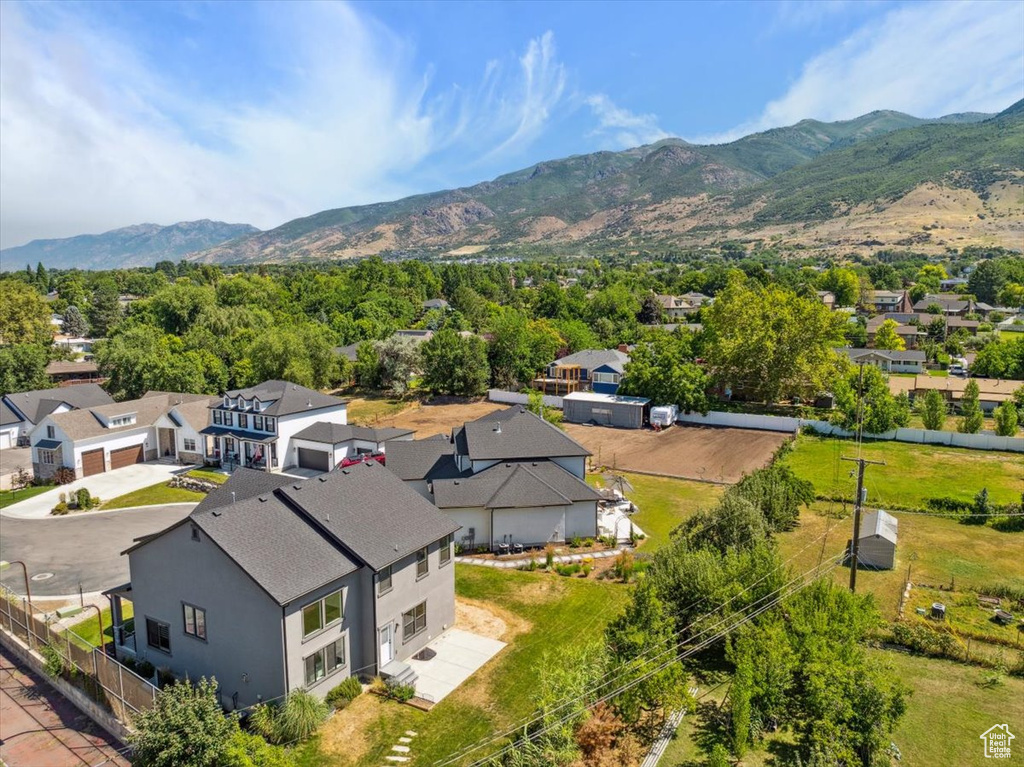Aerial perspective of suburban area with a mountainous background