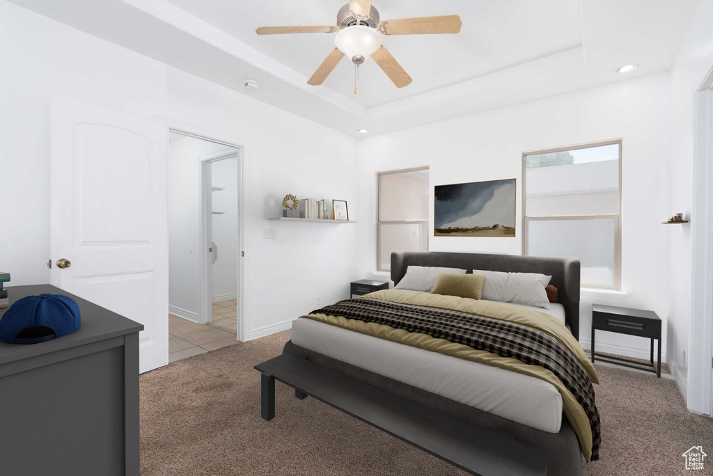 Bedroom with carpet floors, recessed lighting, a tray ceiling, and ceiling fan