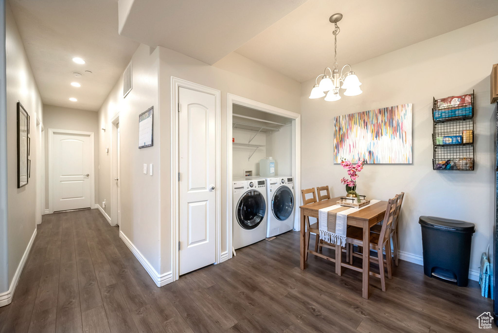 Dining space featuring a chandelier, dark wood-style flooring, recessed lighting, and washer and dryer