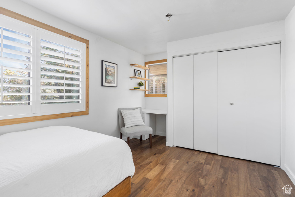 Bedroom featuring a closet and wood finished floors