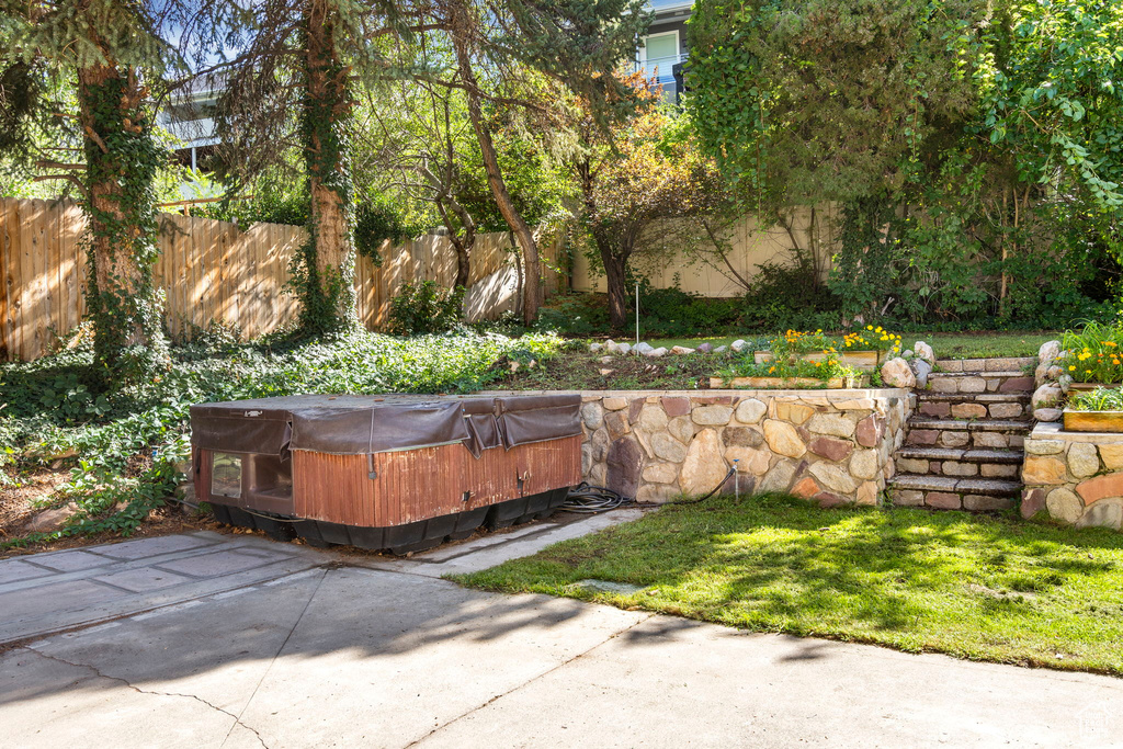 View of patio featuring a hot tub