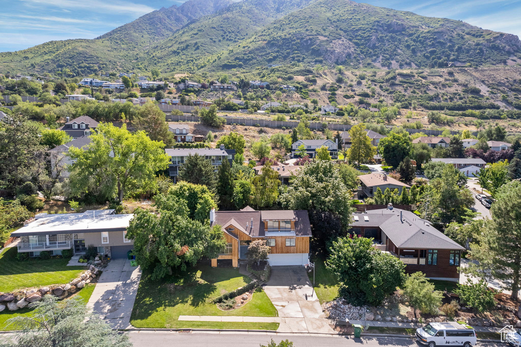 Aerial view of residential area with a mountainous background