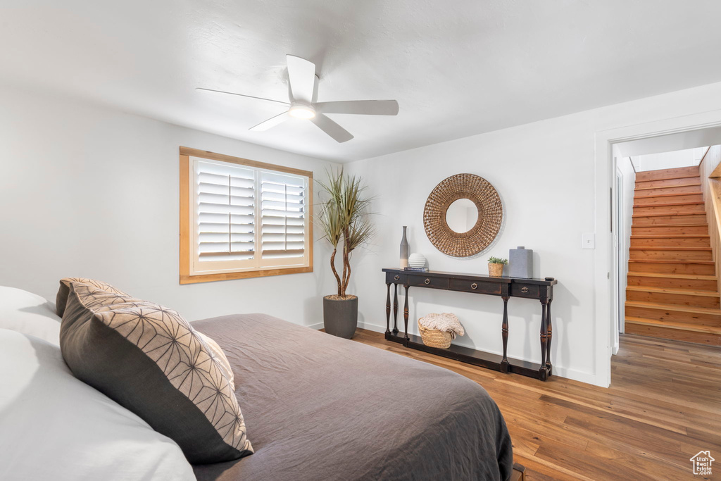 Bedroom with wood finished floors and a ceiling fan