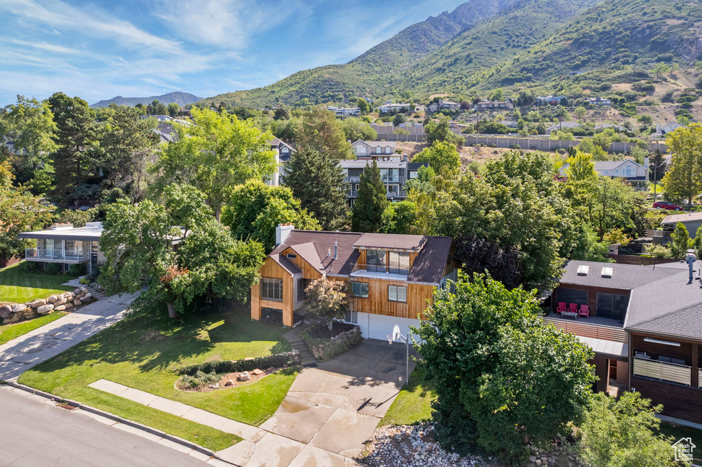 Aerial perspective of suburban area featuring a mountainous background