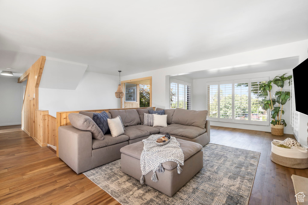 Living room with hardwood / wood-style flooring