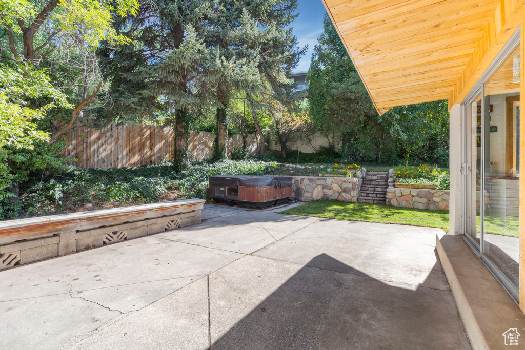 View of patio featuring a hot tub