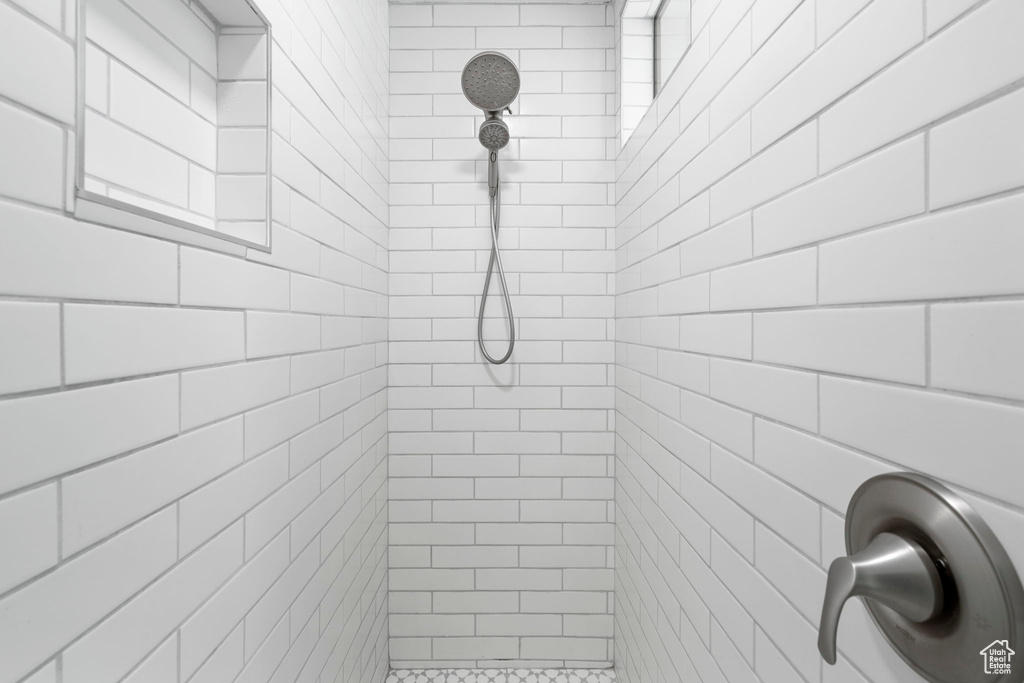 Full bathroom with tiled shower